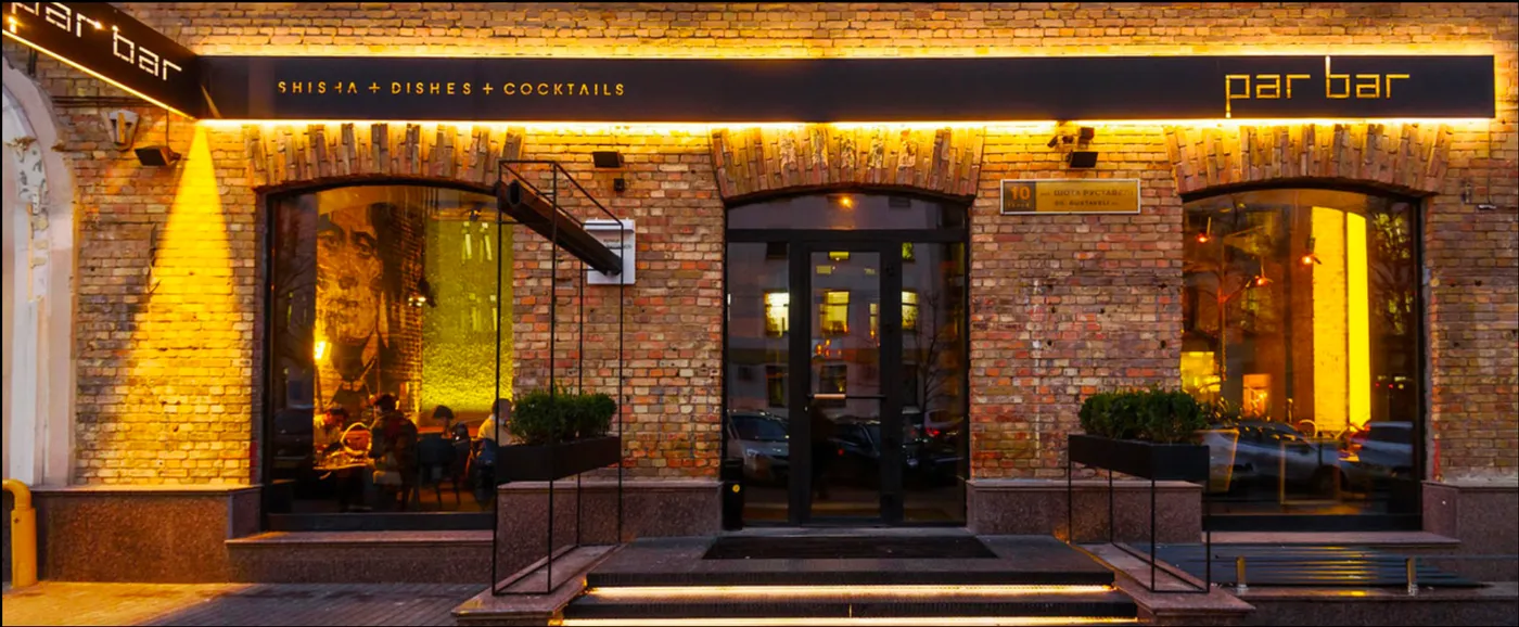 Panoramic interior with neon Par Bar sign