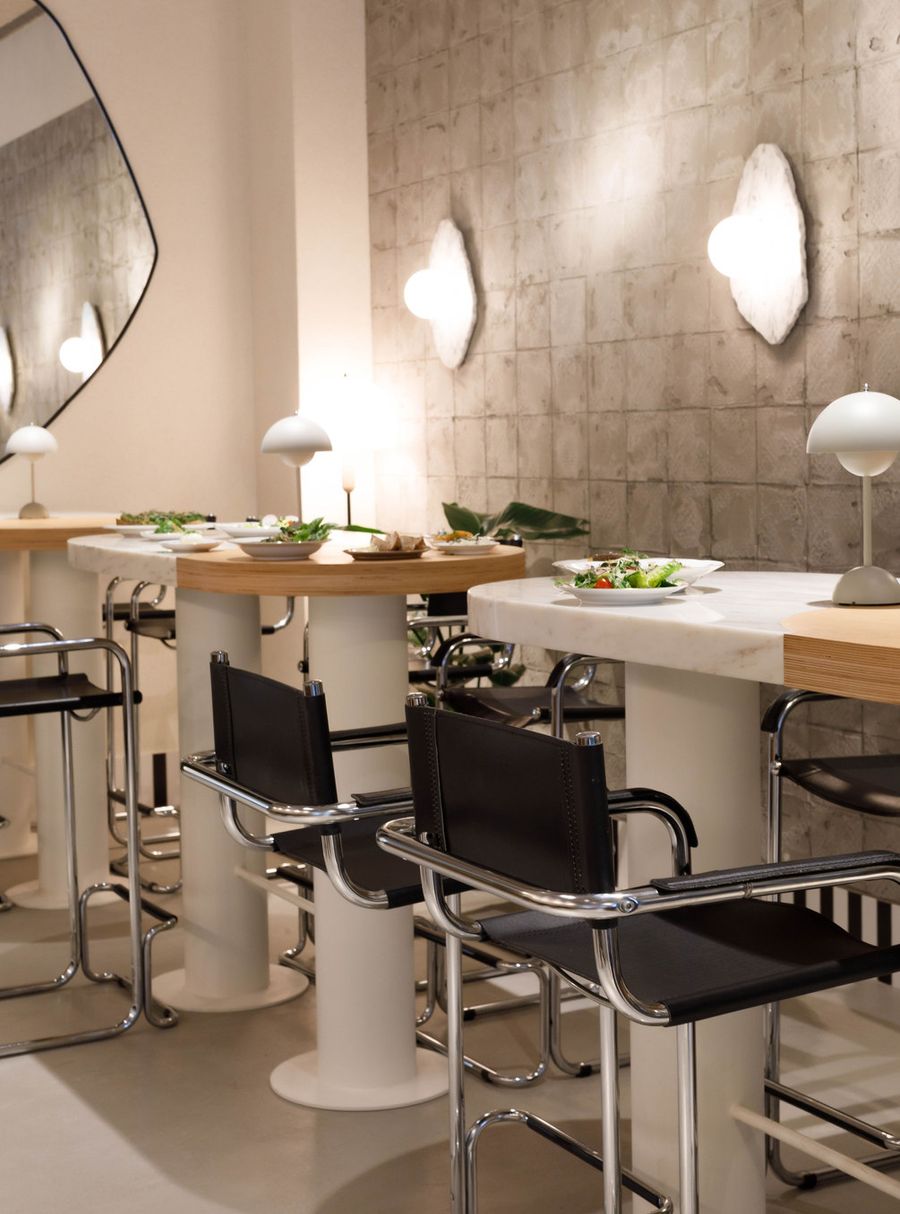 Interior dining room with cloud-shaped wall lamps