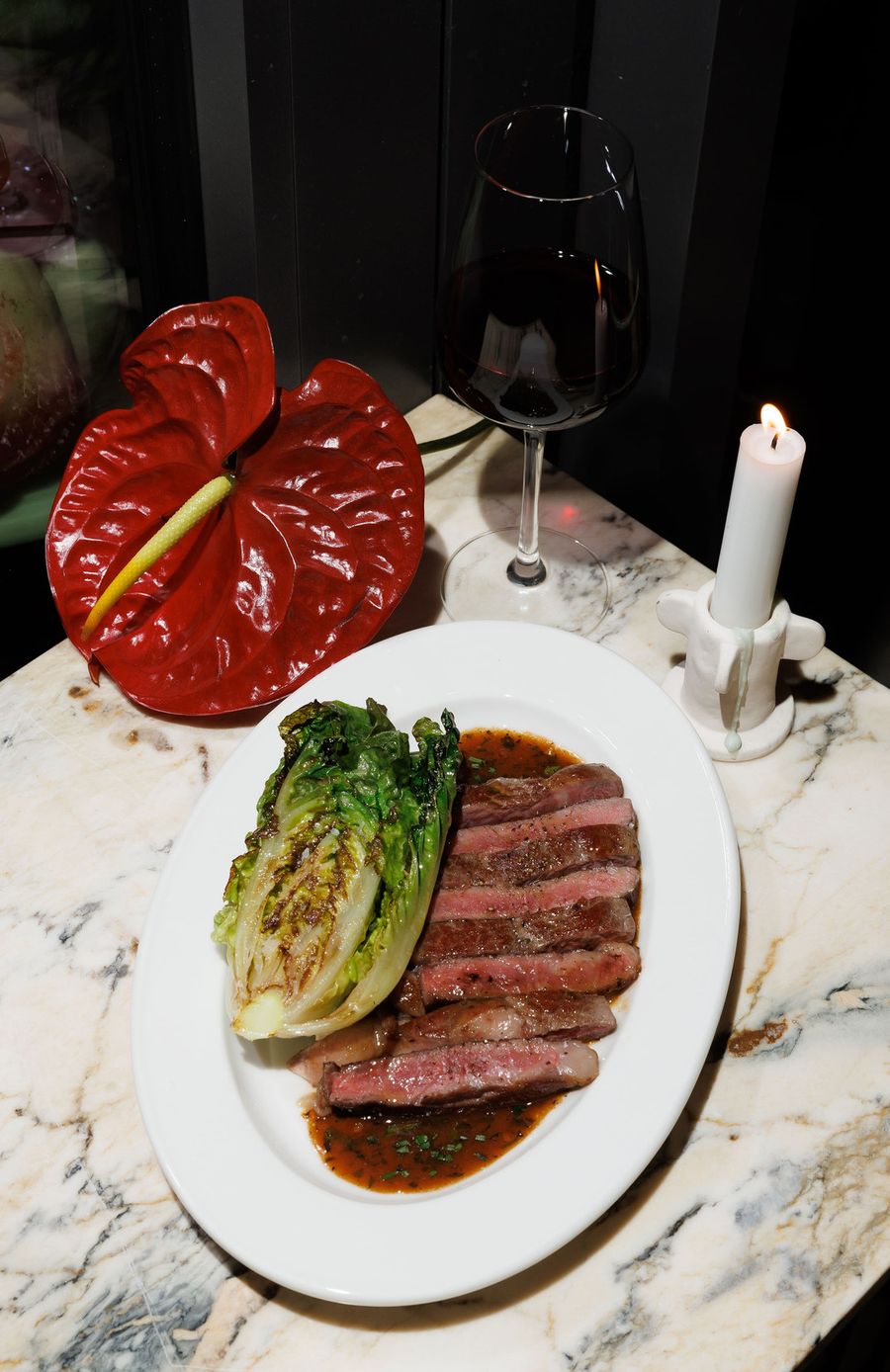 Steak dish with red wine and candlelight